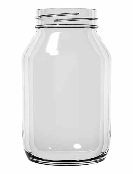 A large glass jar with a lid on top of it.