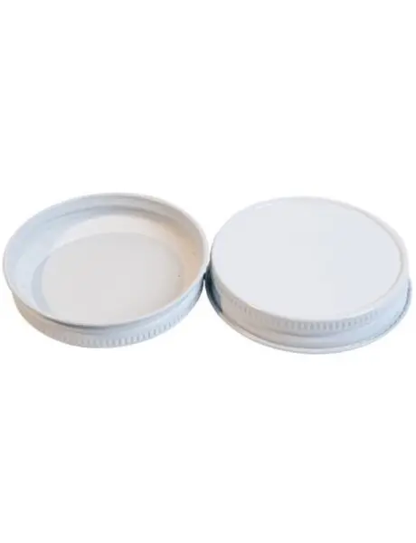 A white lid and bottom of two empty jars.