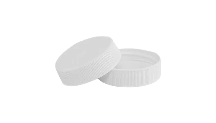 A picture of white plastic ribbed closures
