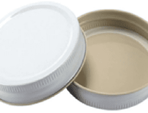 A white and brown lid next to each other.