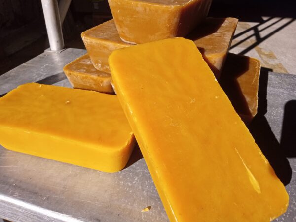 A pile of yellow soap sitting on top of a table.